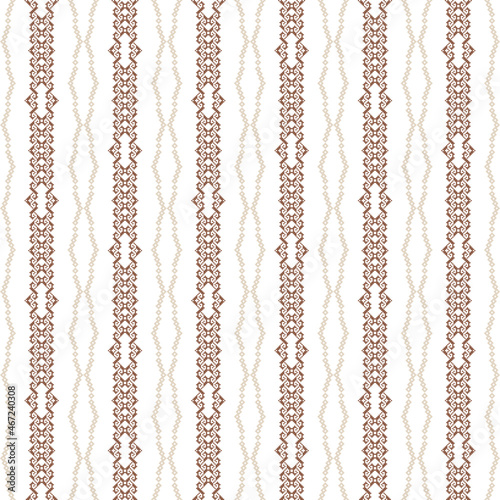Geometric seamless pattern of brown and purple squares in a flat style ornament in the form of pixels. Embroidery dotted schemes. Textile geo prints. 