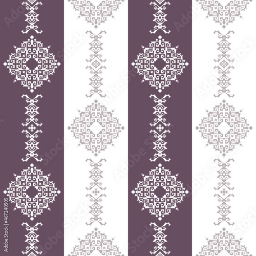 Geometric seamless pattern of brown and purple squares in a flat style ornament in the form of pixels. Embroidery dotted schemes. Textile geo prints. 