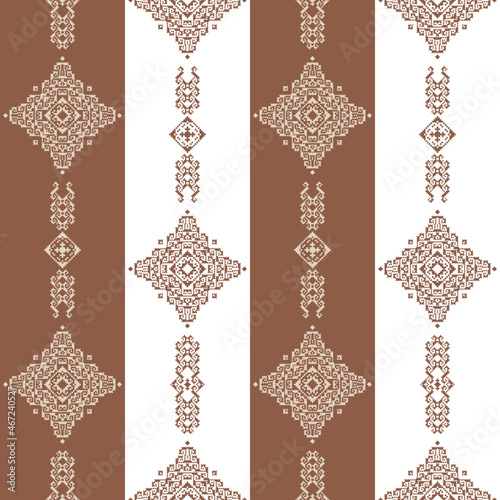 Geometric seamless pattern of brown and purple squares in a flat style ornament in the form of pixels. Embroidery dotted schemes. Textile geo prints. 