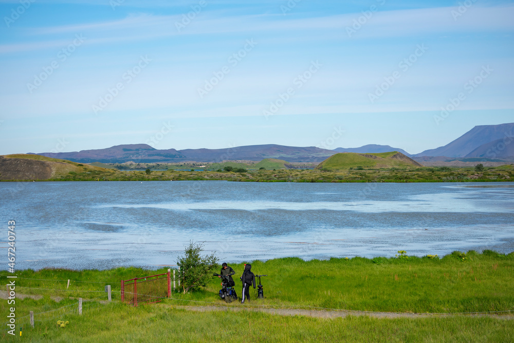 Landscape of Lake Myvatyn with people walking Diamond Circle Iceland