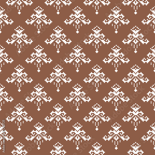 Geometric seamless pattern of brown and purple squares in a flat style ornament in the form of pixels. Embroidery dotted schemes. Textile geo prints. 