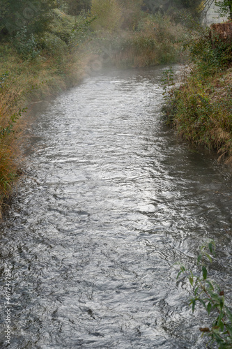 Vaduz, Liechtenstein, October 11, 2021 Steam over a small river in the morning