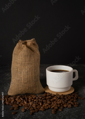 cup of coffee and sack with coffee beans