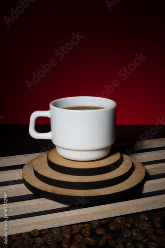 Cup of coffee on a red background