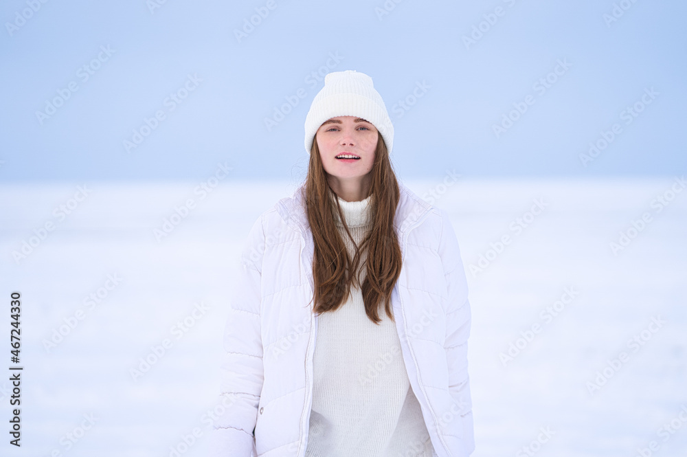Closeup of happy women in hat and sweateron snow outdoor Closeup of happy women in hat and sweateron snow outdoor
