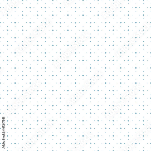 Pattern in blue polka dots of different sizes on a white background. Texture for fabric, clothing, wallpaper, wrapping paper, stationery. 