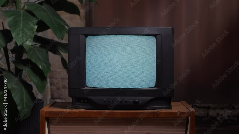 Home interior old television set. Bad television signal noise. 90s retro tv screen static noise. Living room old tv set. Analog static effect retro tv room interior. Television in retro interior home