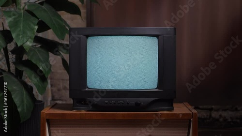 Home interior old television set. Bad television signal noise. 90s retro tv screen static noise. Living room old tv set. Analog static effect retro tv room interior. Television in retro interior home