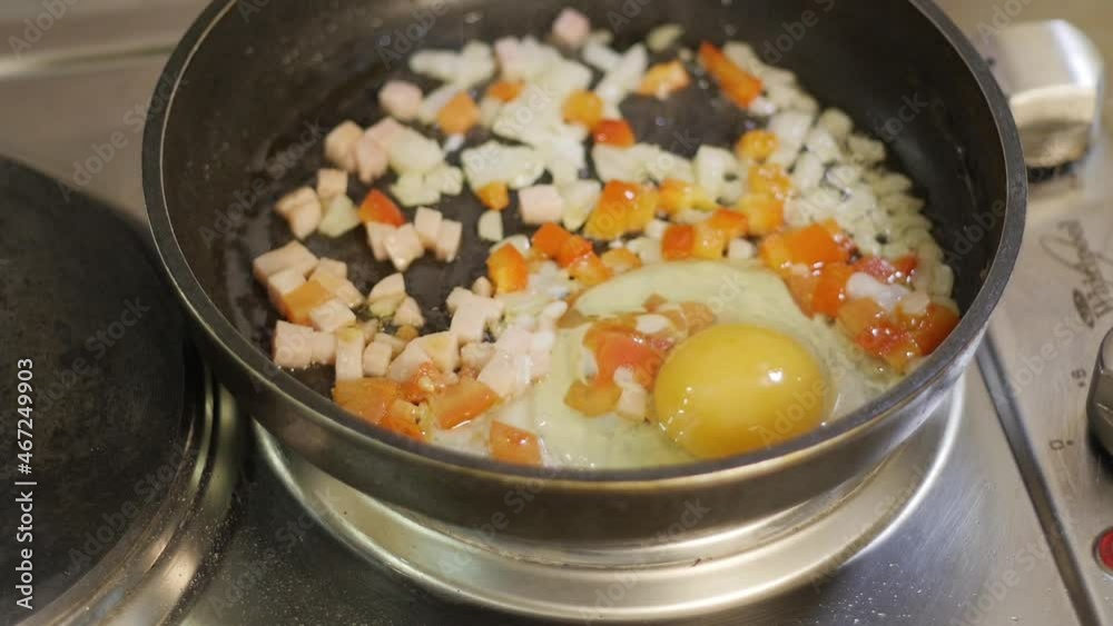 Cook Breaking Eggs in a frying Pan with Vegetables
Cook Breaking Eggs in a frying Pan with Vegetables