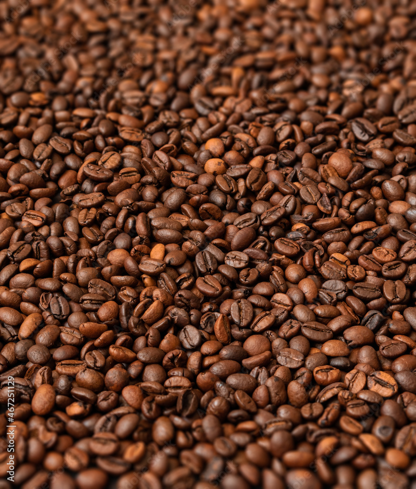 Fresh roasted coffee beans background. Selective focus. Fresh roasted coffee beans background. Selective focus.