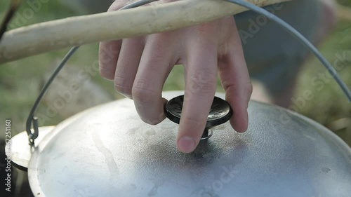 The lifting Lid over a Boiling Broth
