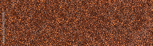 Fresh roasted coffee beans background. Top view. Horizontal banner