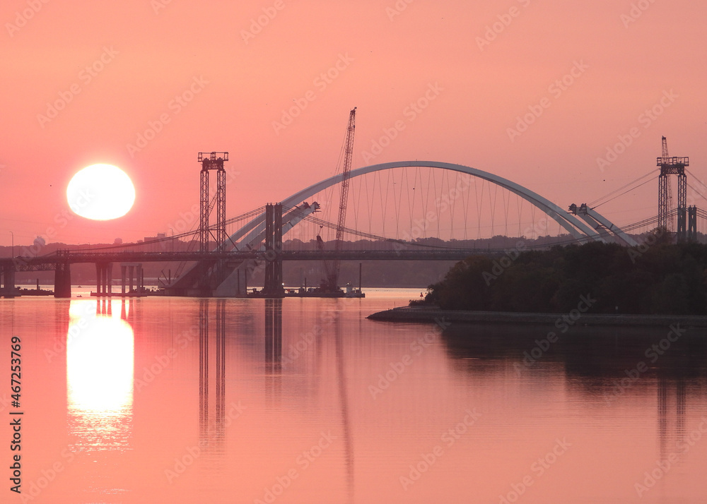 Pink sunrise at Iowa bridge construction site