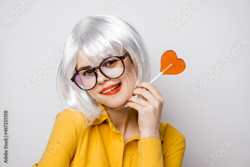 attractive woman with glasses white wig lollipop fashion glamor © VICHIZH