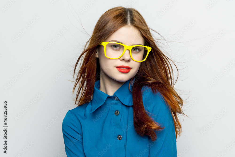 Business woman in blue shirt wearing yellow glasses emotions Business woman in blue shirt wearing yellow glasses emotions
