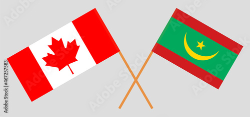 Crossed flags of Canada and Mauritania. Official colors. Correct proportion