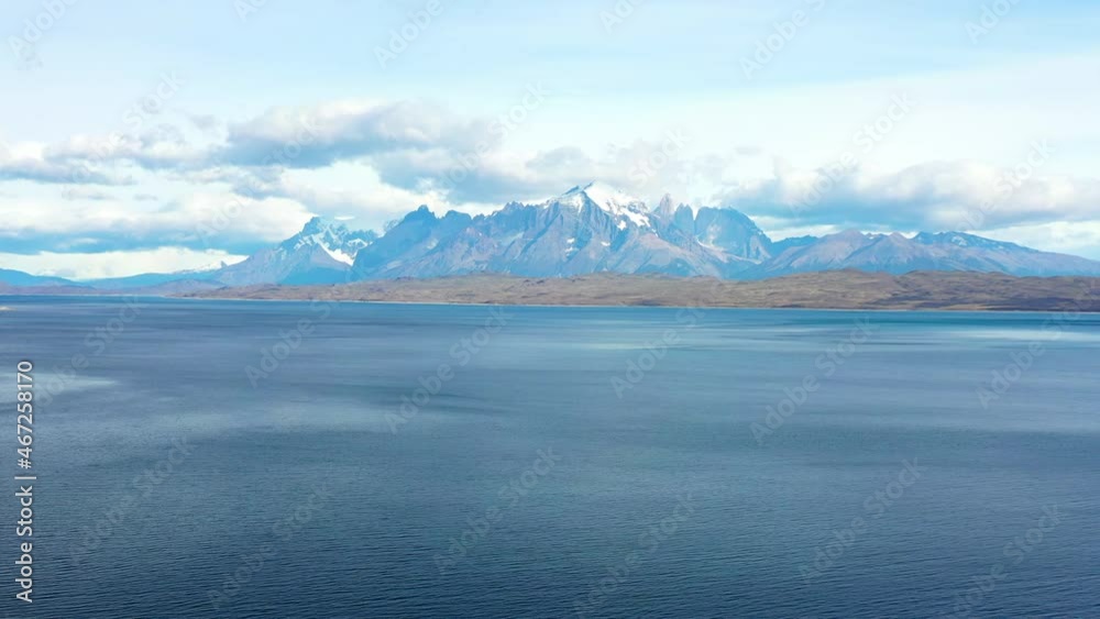 Aerial: Idyllic Shot Of Snowcaped Mountains, Drone Flying Backwards Over Lake - Torres del Paine National Park, Chile Aerial: Idyllic Shot Of Snowcaped Mountains, Drone Flying Backwards Over Lake - Torres del Paine National Park, Chile