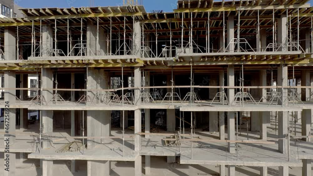Building crane and monolituc building under construction. Construction site. Building crane and monolituc building under construction. Construction site.