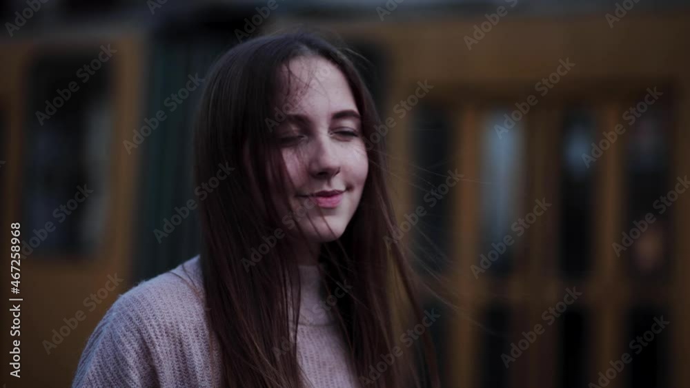 Close Up Portrait of beautiful woman Standing on the Wind. Breeze is playing with girls hair. Portrait of gorgeous girl Close Up Portrait of beautiful woman Standing on the Wind. Breeze is playing with girls hair. Portrait of gorgeous girl