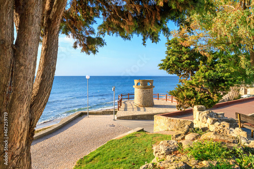 Seaside cityscape - view of the embankment with stone tower in the Old Town of Nesebar, on the Black Sea coast of Bulgaria