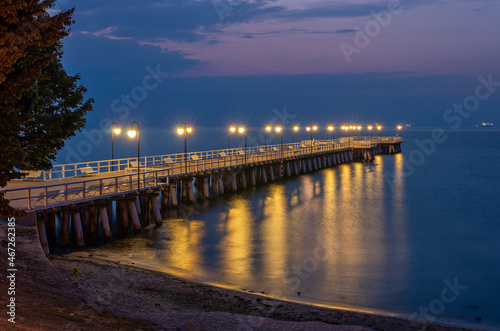 Baltic sea coast, night view of pier at Gdynia Orlowa sea resort, Poland. © tomeyk