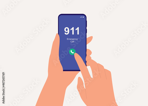 Close-Up View Of A Person's Hand With Mobile Phone Calling 911.