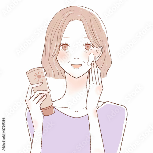 保湿クリームを手に取る中年女性