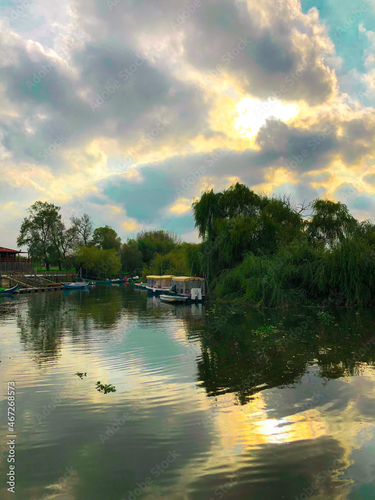 Obraz premium Lake, boat, sky and trees
