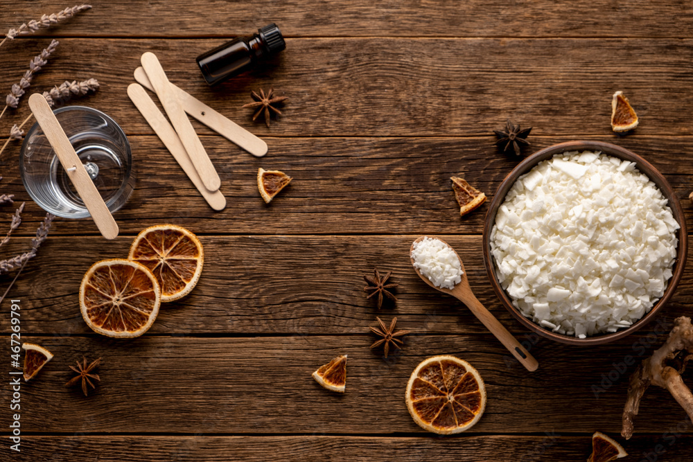 Set for crafting candle on wooden background. Eco soy wax on white table. DIY candle. Hobby concept. Set for crafting candle on wooden background. Eco soy wax on white table. DIY candle. Hobby concept.