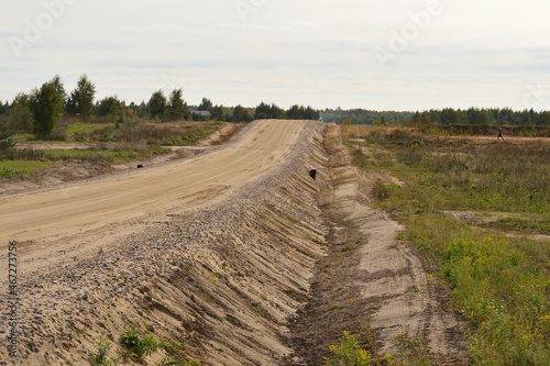 Bild auf Leinwand Compacted soil in the embankment during road construction