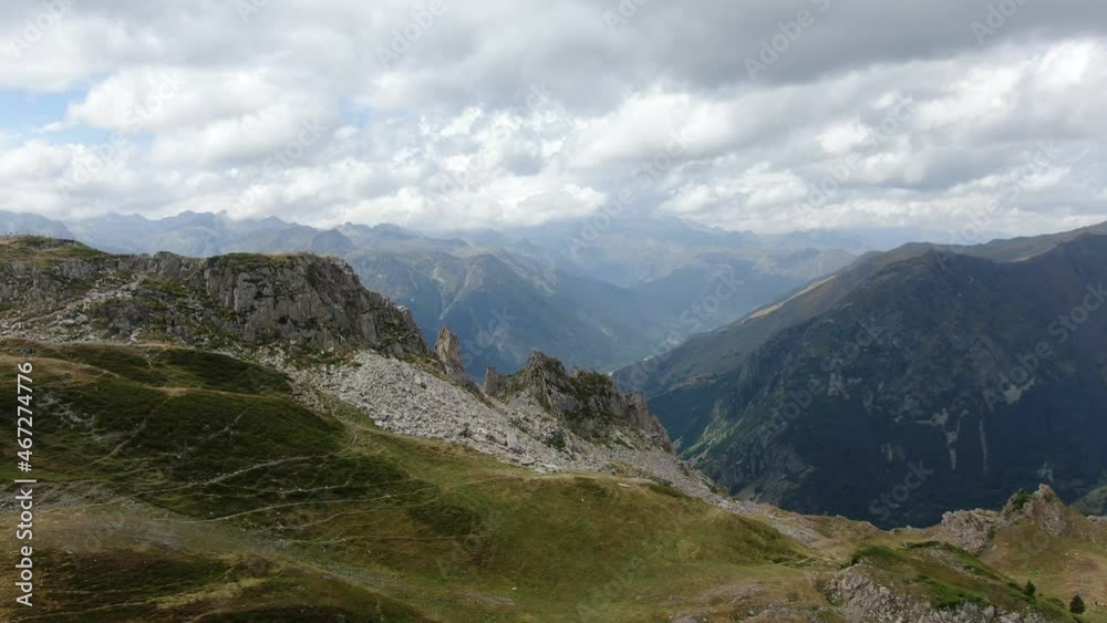 Aran Valley from Baqueira-Beret on a cloudy day. Aerial dolly in flying over the Pyrenees Aran Valley from Baqueira-Beret on a cloudy day. Aerial dolly in flying over the Pyrenees