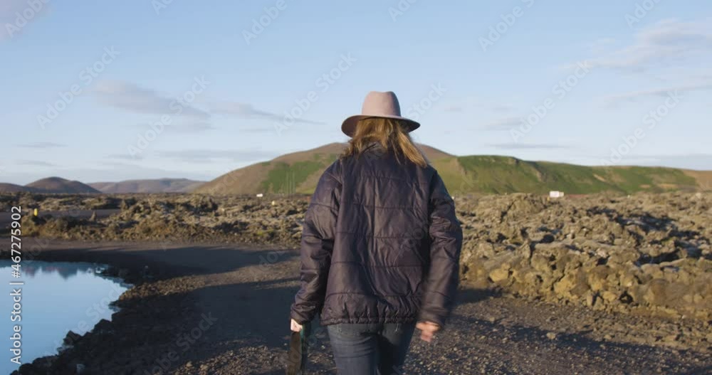 Unrecognizable woman photographer visiting blue lagoon, Iceland Unrecognizable woman photographer visiting blue lagoon, Iceland