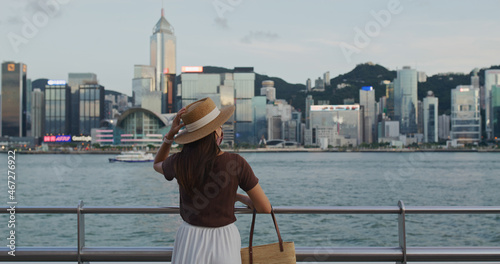 Photography Woman enjoy night view in Hong Kong city