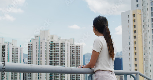 Woman look at the city in Hong Kong