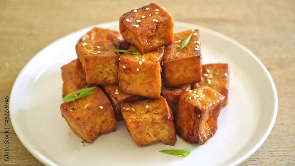 fried tofu with white sesame and teriyaki sauce - vegan and vegetarian food style fried tofu with white sesame and teriyaki sauce - vegan and vegetarian food style