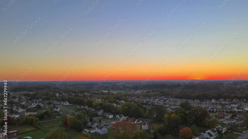 Aerial View Of Suburban Houses In Sunset - drone shot Aerial View Of Suburban Houses In Sunset - drone shot