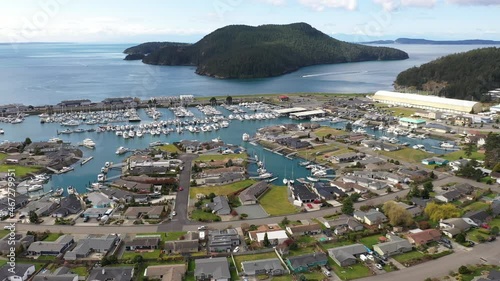 Cinematic 4K aerial drone footage of Burrows Pass and Island, Tugboat Beach, Portalis, Anaco Beach, Washington Park, Anacortes waterfront, a charming, quaint old town near Seattle photo