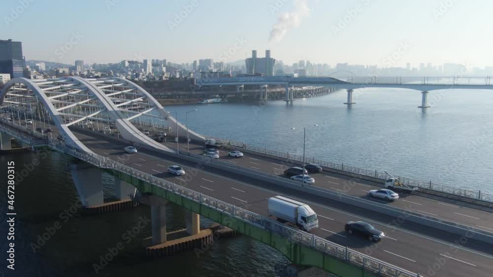 Traffic on the Yanghwa bridge in Seoul.
Cars are moving on a arch bridge over a Han river at sunny day morning. Aerial view. South Korea.
서울 한강 양화대교. Traffic on the Yanghwa bridge in Seoul.
Cars are moving on a arch bridge over a Han river at sunny day morning. Aerial view. South Korea.
서울 한강 양화대교.