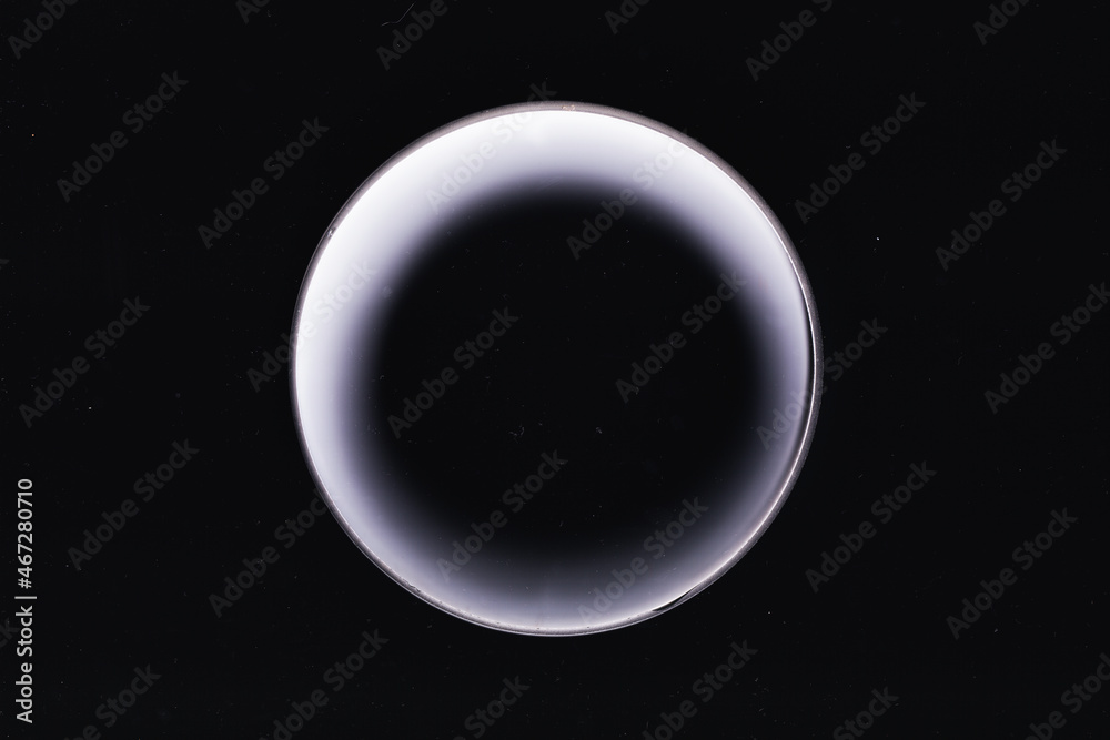 Abstract space wallpaper. White moon. White glowing circle on black background