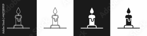 Set Burning candle in candlestick icon isolated on black and white background. Cylindrical candle stick with burning flame. Vector