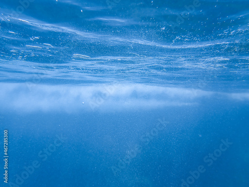 Underwater sea bubbles, bubble wave under the ocean, blue sea water bubble, real picture suitable for background.