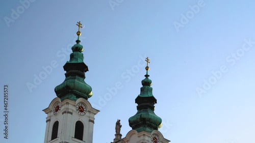 St. Judas Tade Catholic Church in Sopron and the Moon together, close up, panning photo