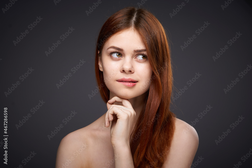 woman with bare shoulders and beautiful hairstyle close-up attractive look woman with bare shoulders and beautiful hairstyle close-up attractive look