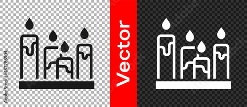 Black Burning candle icon isolated on transparent background. Cylindrical aromatic candle stick with burning flame. Happy Halloween party. Vector
