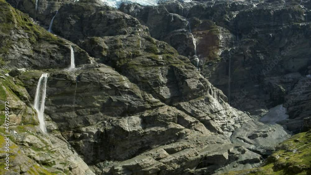 Aerial: Scenic Shot Of Waterfall In Sunlight During Winter Season, Drone Flying Forward Over River - Aukland, New Zealand Aerial: Scenic Shot Of Waterfall In Sunlight During Winter Season, Drone Flying Forward Over River - Aukland, New Zealand