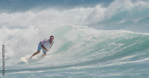 Photography Surfer surfing in tropical ocean wave