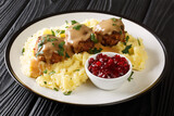 Scandinavian Meatball Lihapullat with mashed potatoes and lingonberry jam close-up in a plate on the table. Horizontal