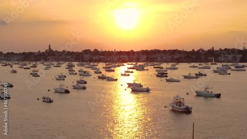 Big yellow sun sunset at Marblehead harbor full of yachts, Essex County photo