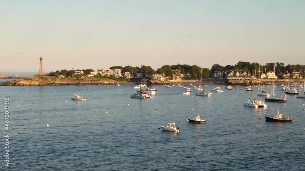Marblehead Neck full of yachts with the light and United States Flag