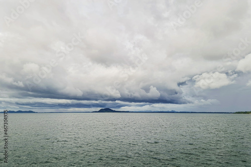 Tropical rain storm cloud sky form over sea ocean with Thailand travel island background in global climate change situation